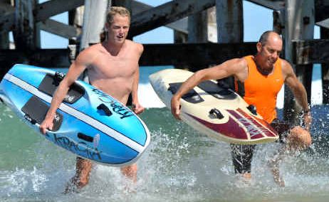 Chasing gold: Daniel Bannerman joins coach and training partner Mark Sutton for a break as they train at Coffs Jetty for tomorrow’s Coolangatta Gold. Chasing gold: Daniel Bannerman joins coach and training partner Mark Sutton for a break as they train at Coffs Jetty for tomorrow’s Coolangatta Gold.